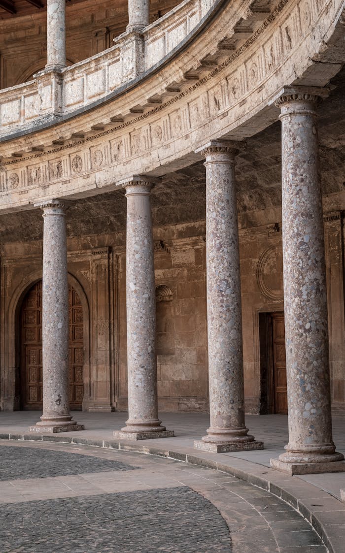Elegant stone columns of the historic Alhambra Palace in Spain.