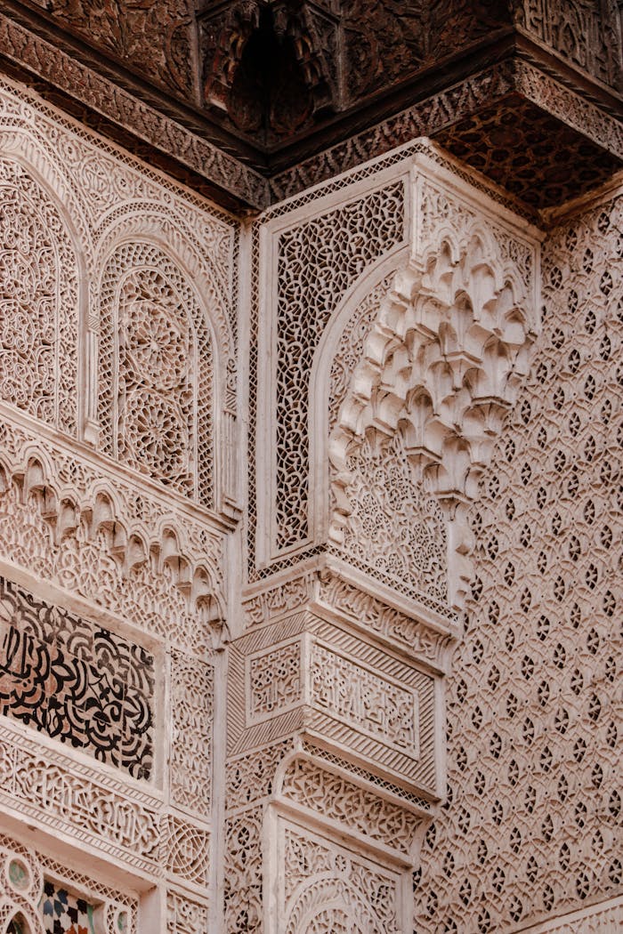 Detailed view of intricate Moorish architectural decoration at Alhambra in Granada, Spain.